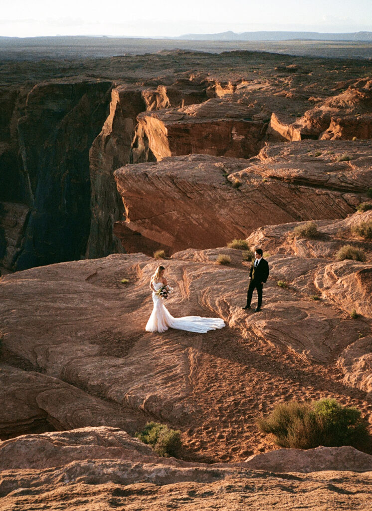 Couple standing in Arizona desert during elopement, captured on 35mm film