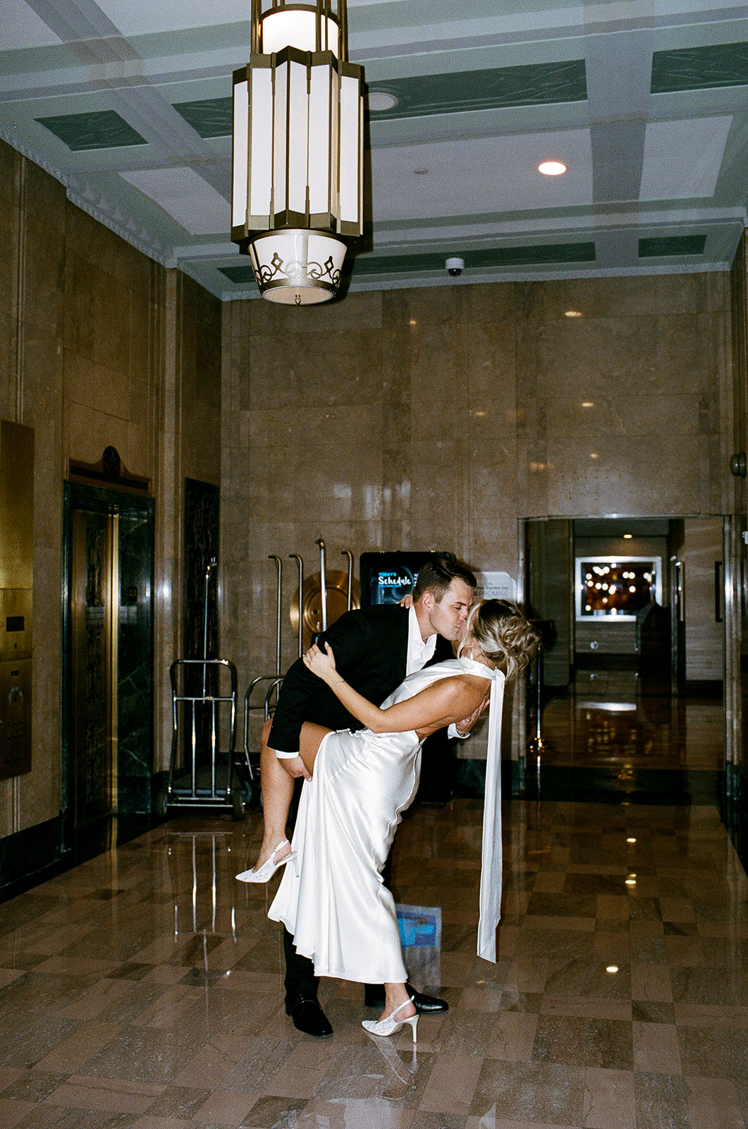Bride and groom kissing inside a Phoenix courthouse
