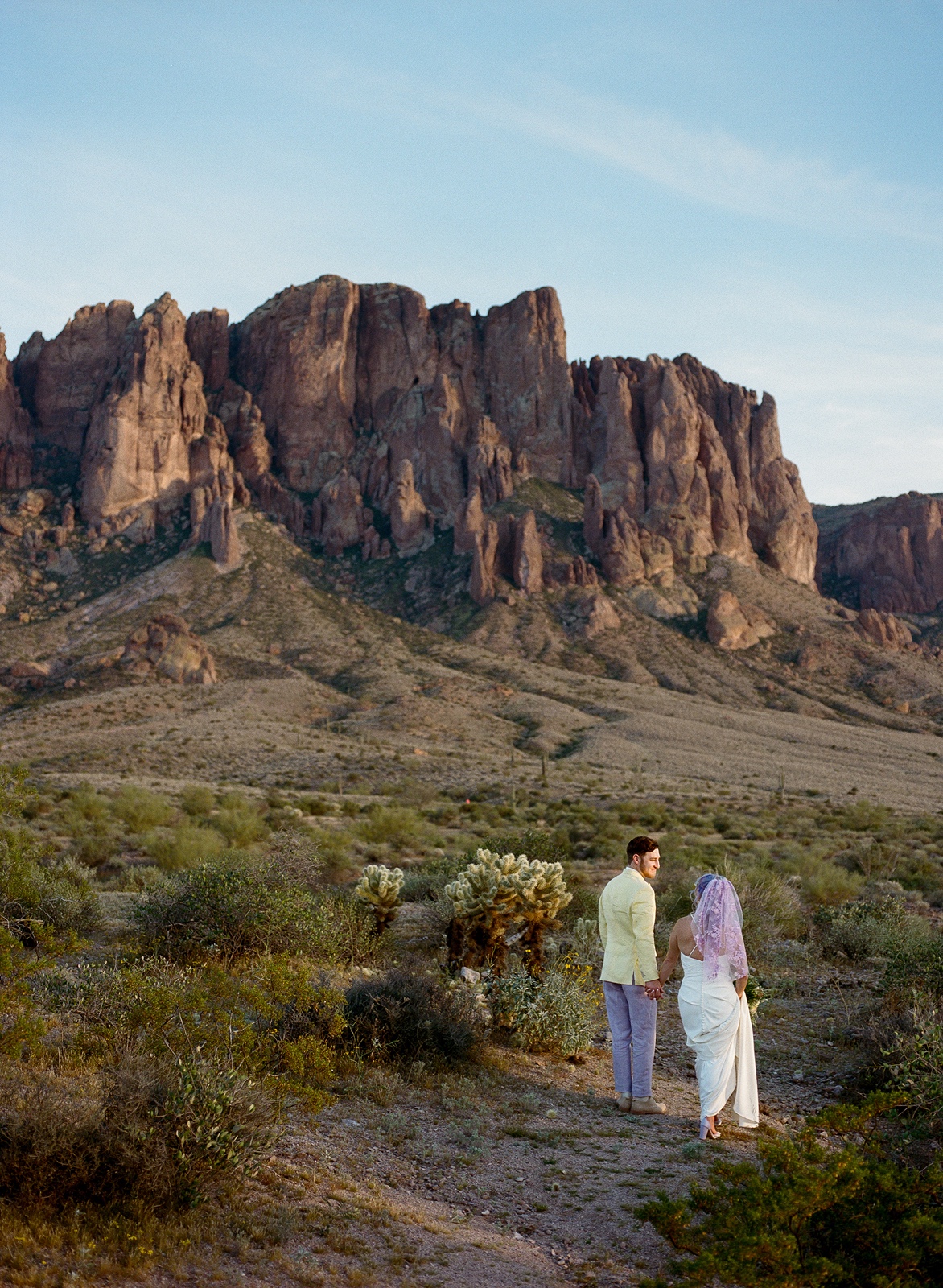 Couple explore at their Lost Dutchman elopement