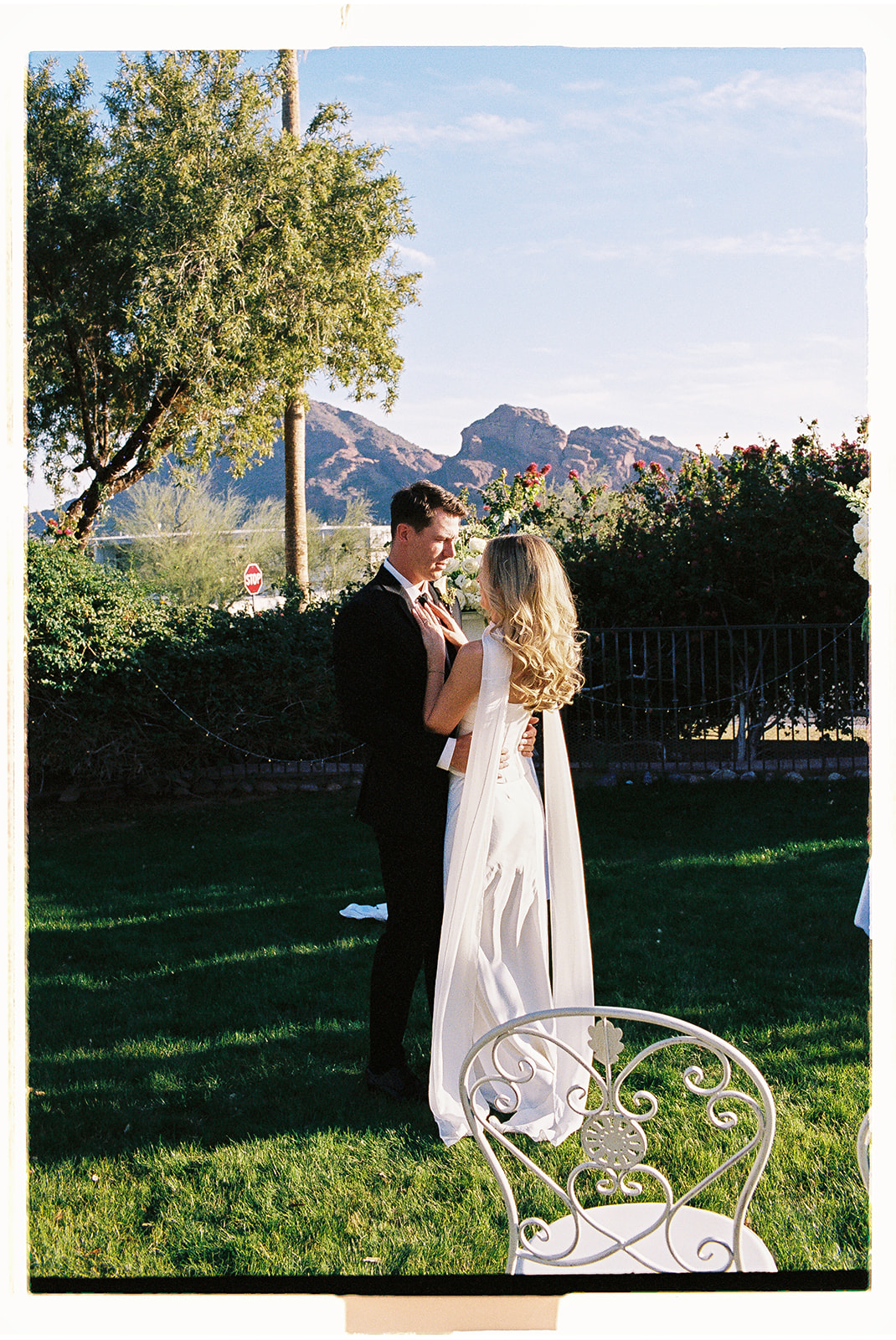 Bride and groom embracing outdoors