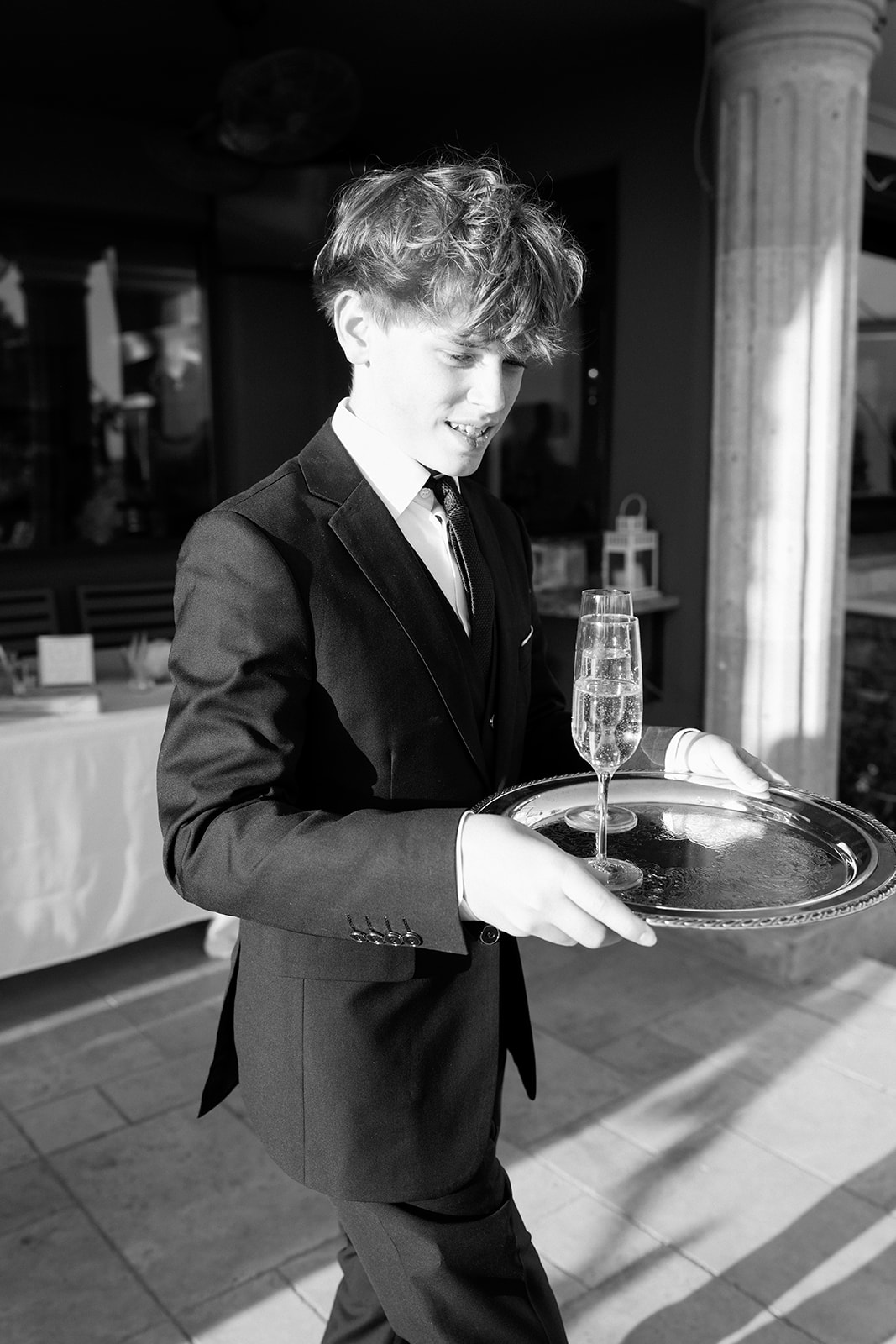 Server holding tray at non-traditional reception