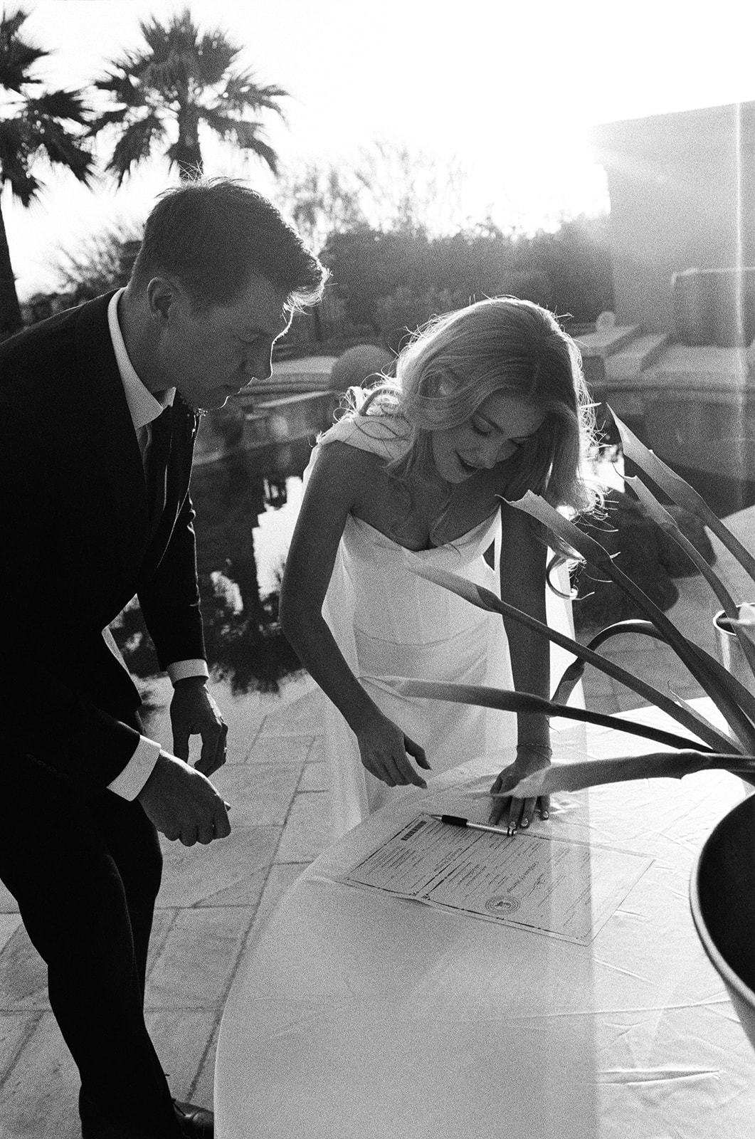 Couple signs marriage license after their non-traditional wedding ceremony