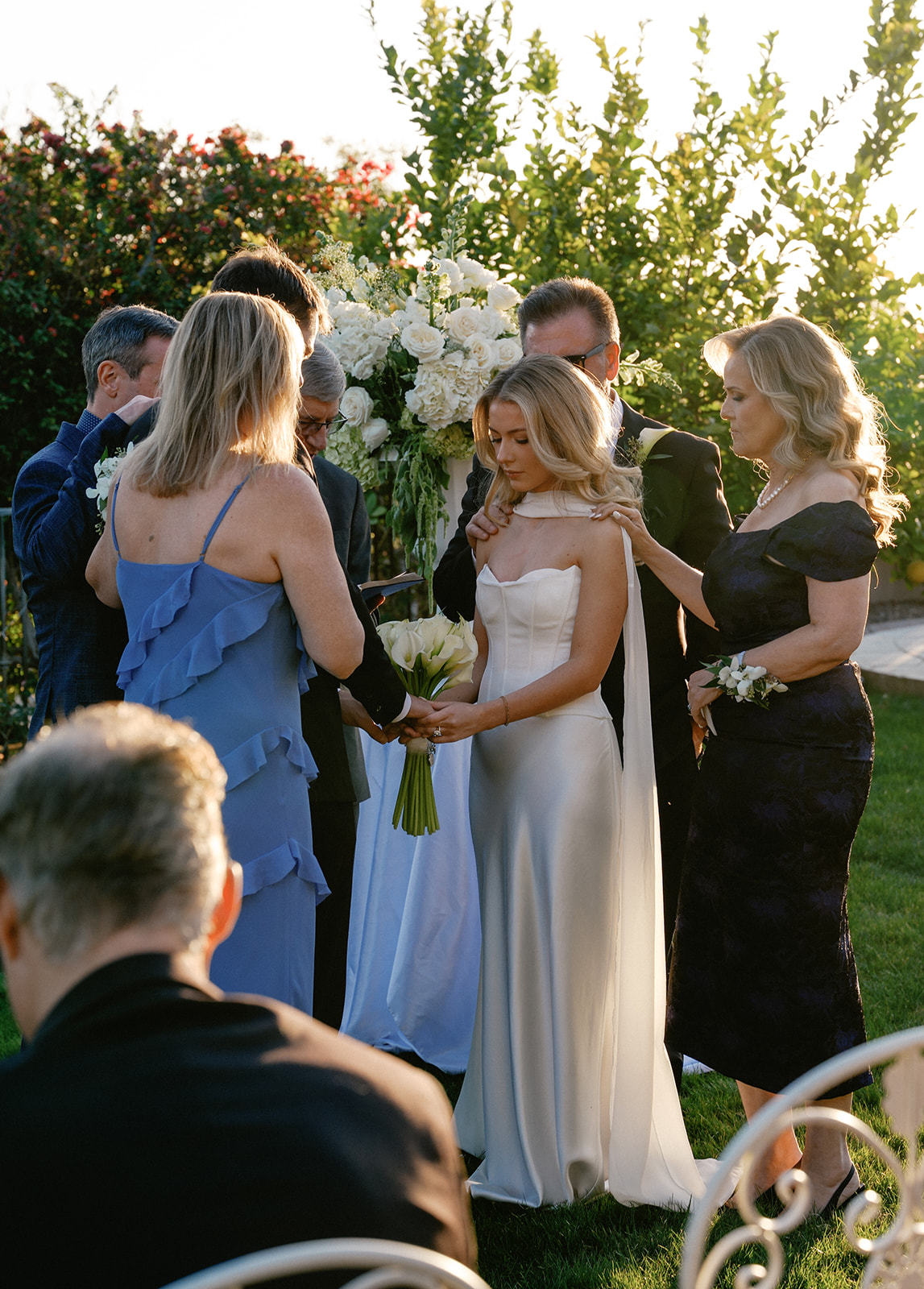 Bride and groom surrounded by family during their non-traditional wedding ceremony