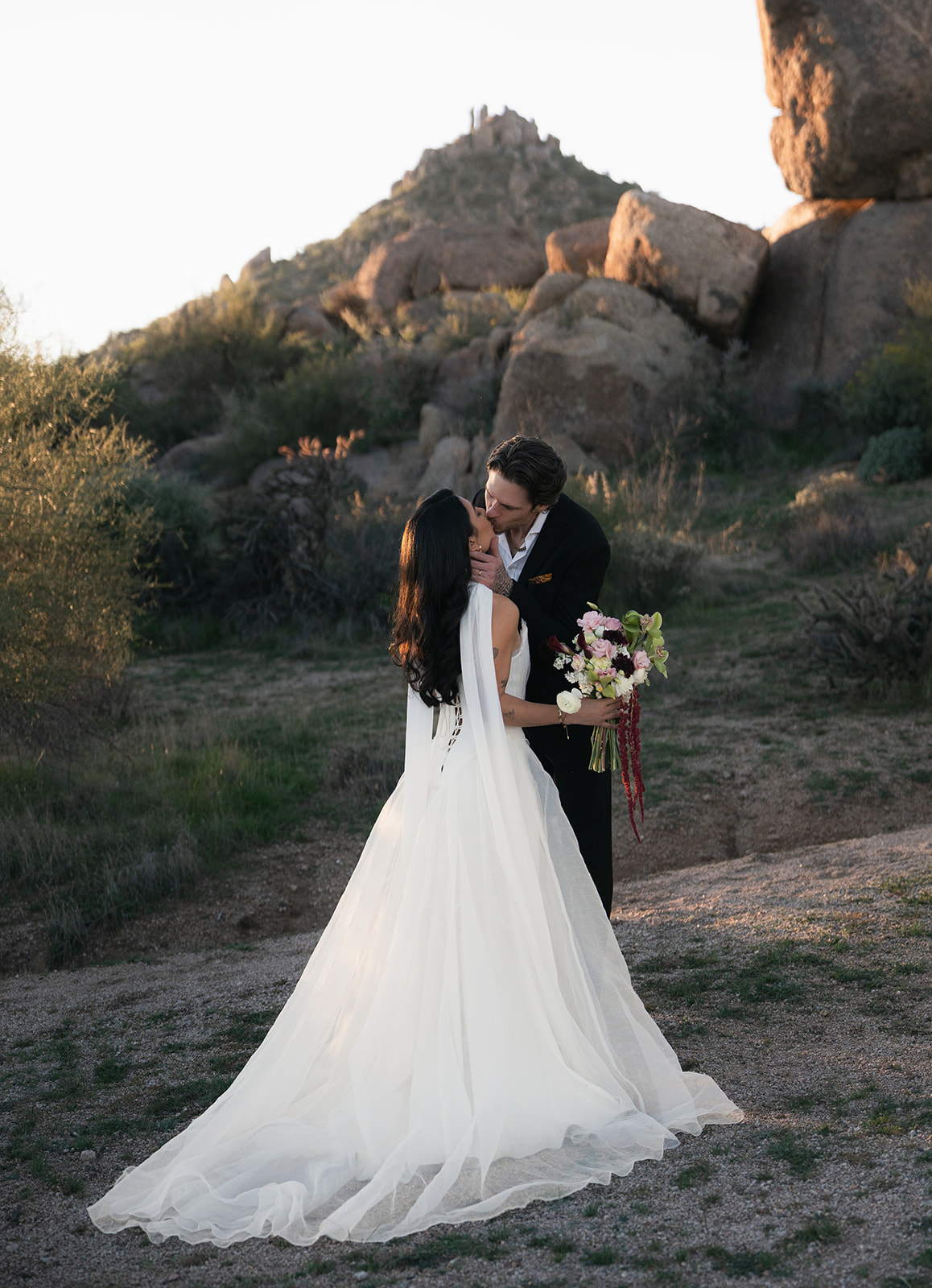 Bride and groom kiss at their first look