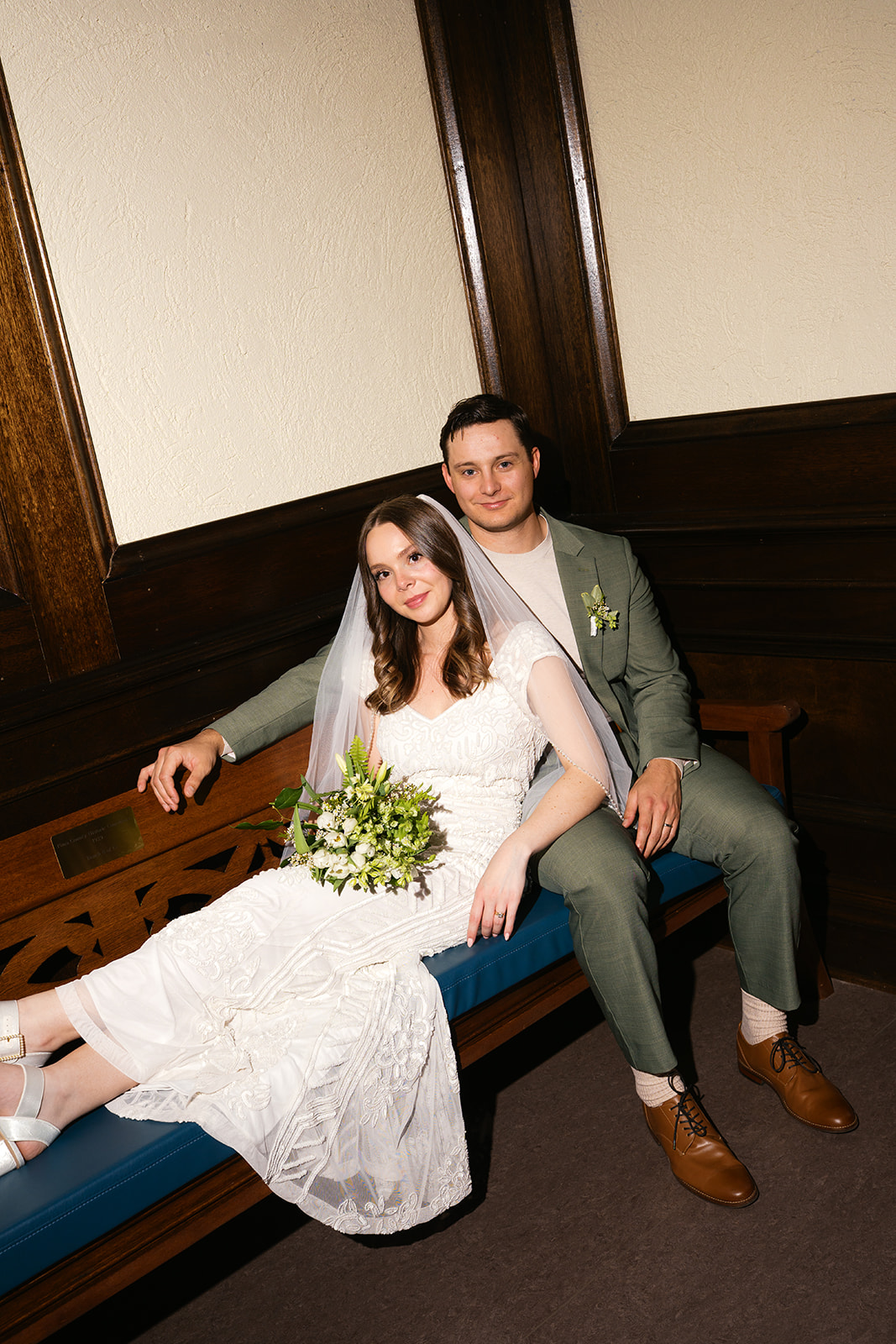 Bride and groom seated together at their non-traditional wedding