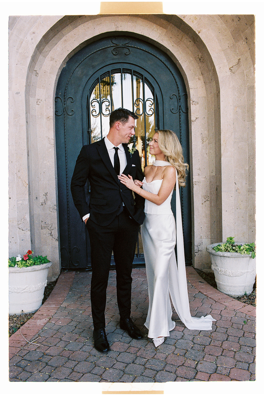 Bride and groom embrace at their non-traditional wedding
