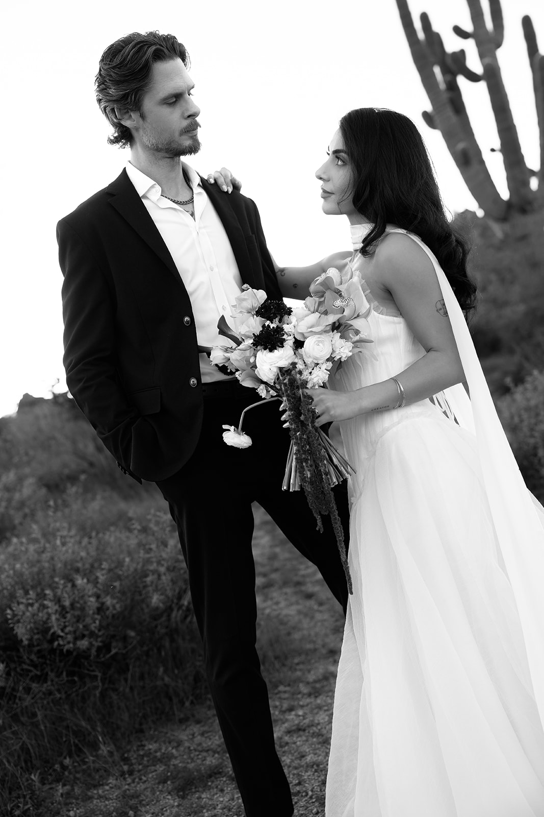 Couple standing together during their non-traditional wedding portraits