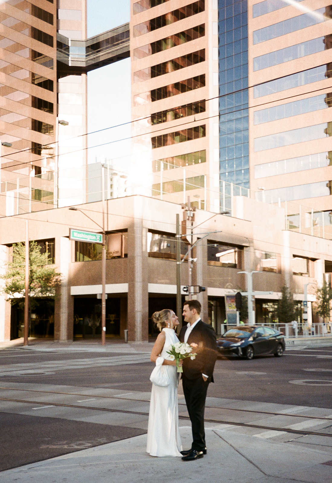 Phoenix courthouse wedding couple crossing downtown street together