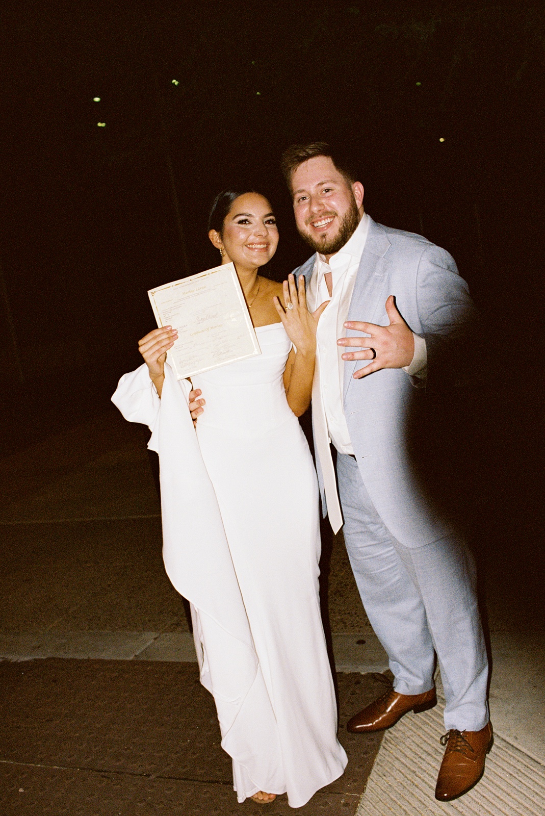 Phoenix courthouse wedding couple holding marriage documents smiling