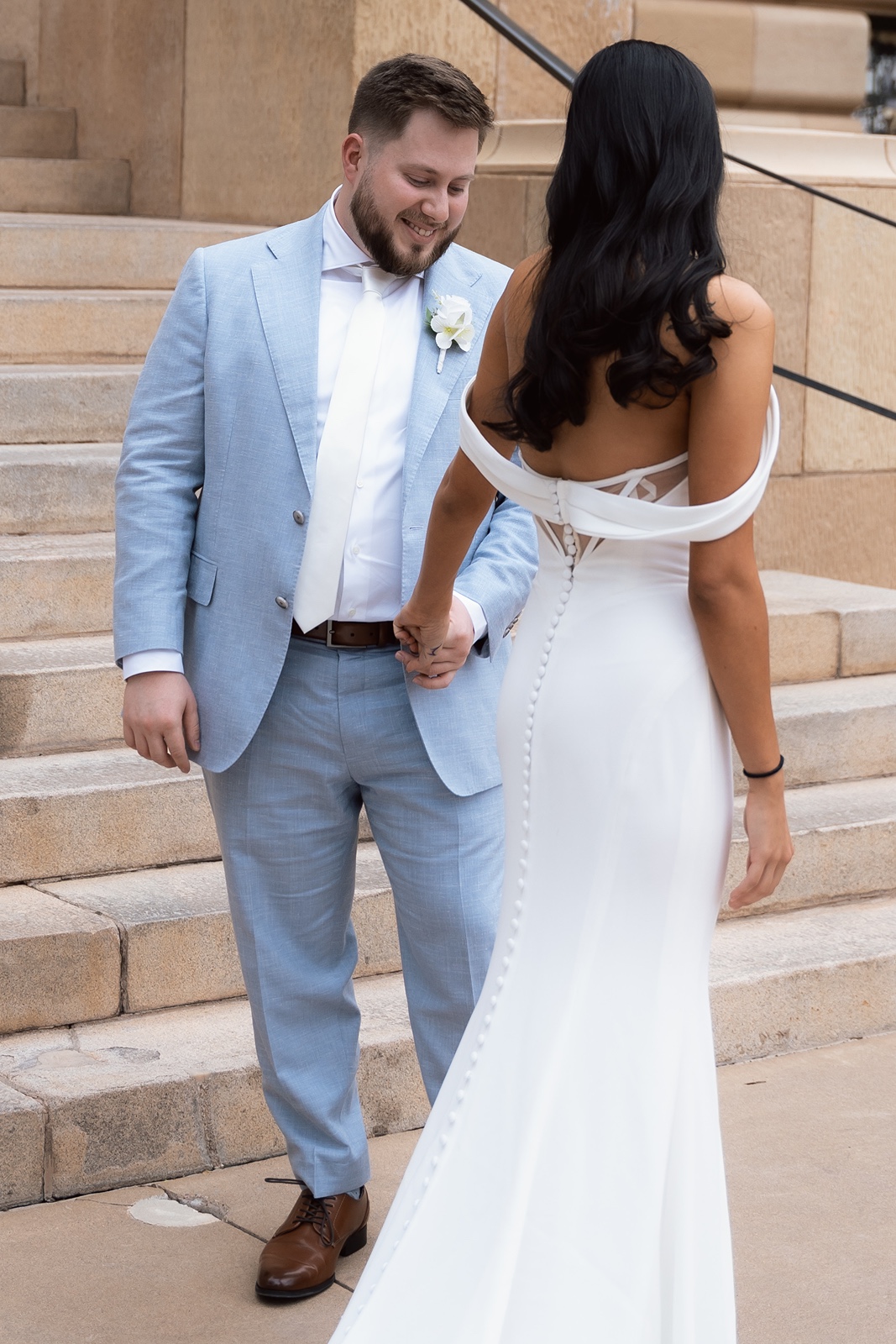 Phoenix courthouse wedding couple holding hands on steps
