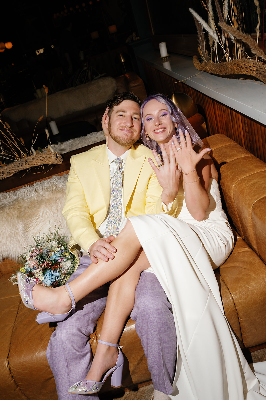 Phoenix courthouse wedding couple relaxing on couch, smiling