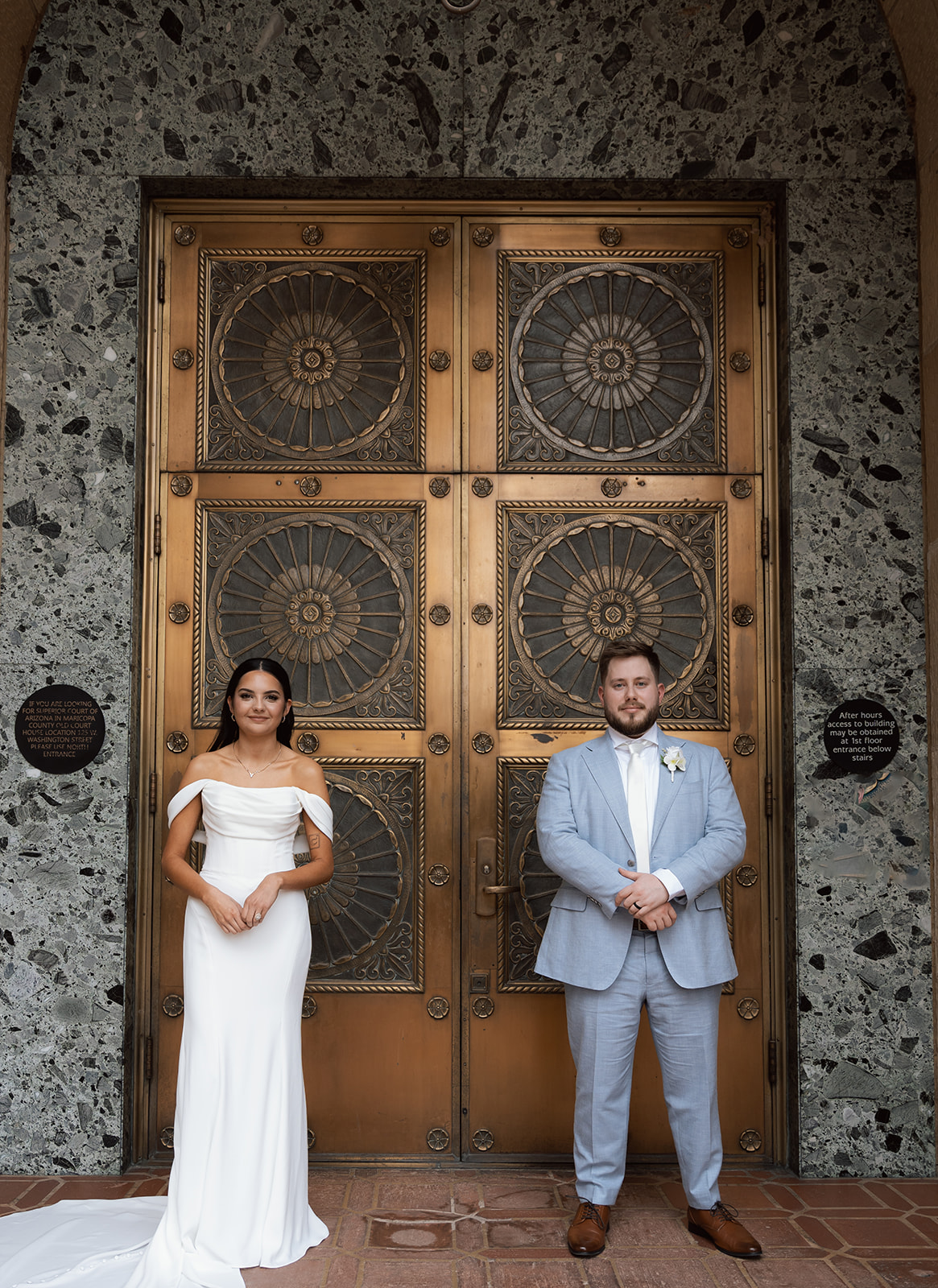Phoenix courthouse wedding couple standing by ornate doors