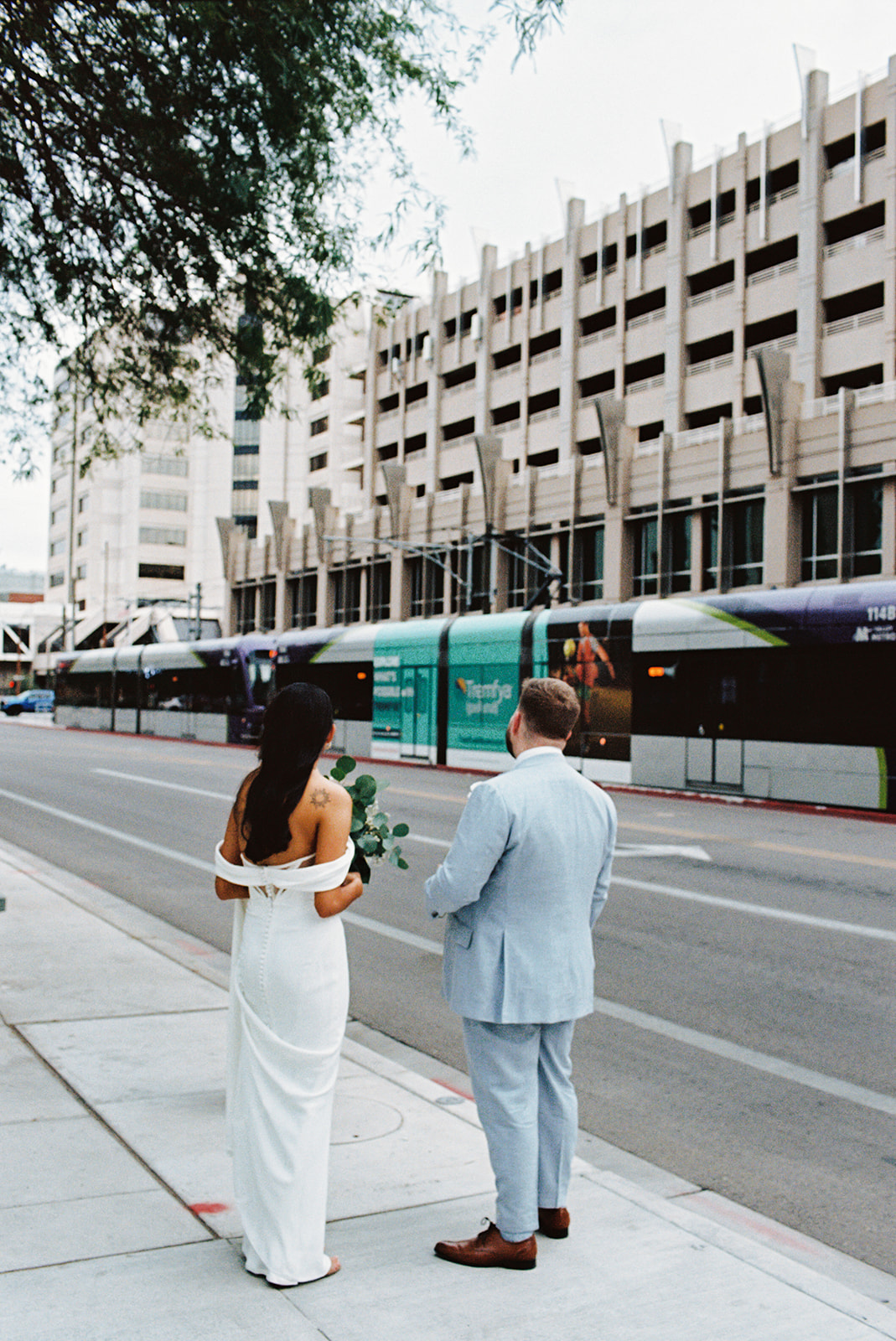 Phoenix courthouse wedding couple walking along downtown street