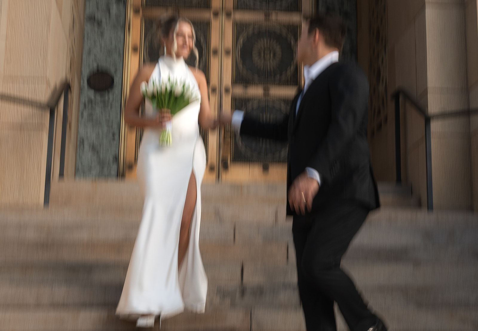 Phoenix courthouse wedding couple laughing together on courthouse steps