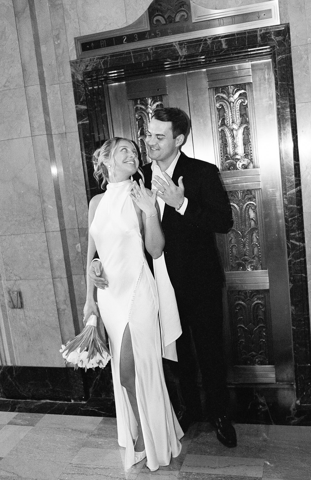 Phoenix courthouse wedding couple showing rings, black-and-white portrait
