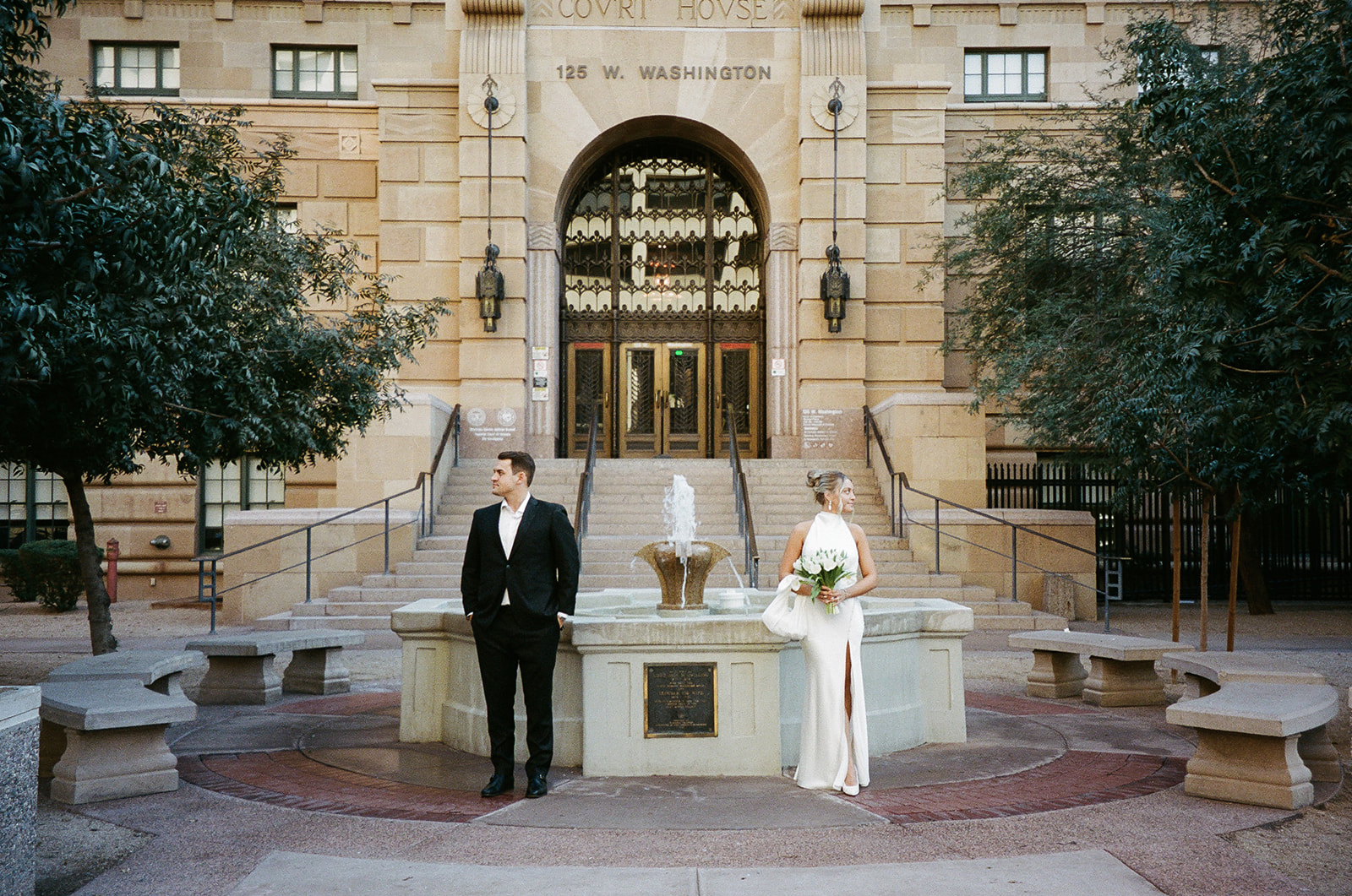 Phoenix courthouse wedding couple standing apart in courtyard