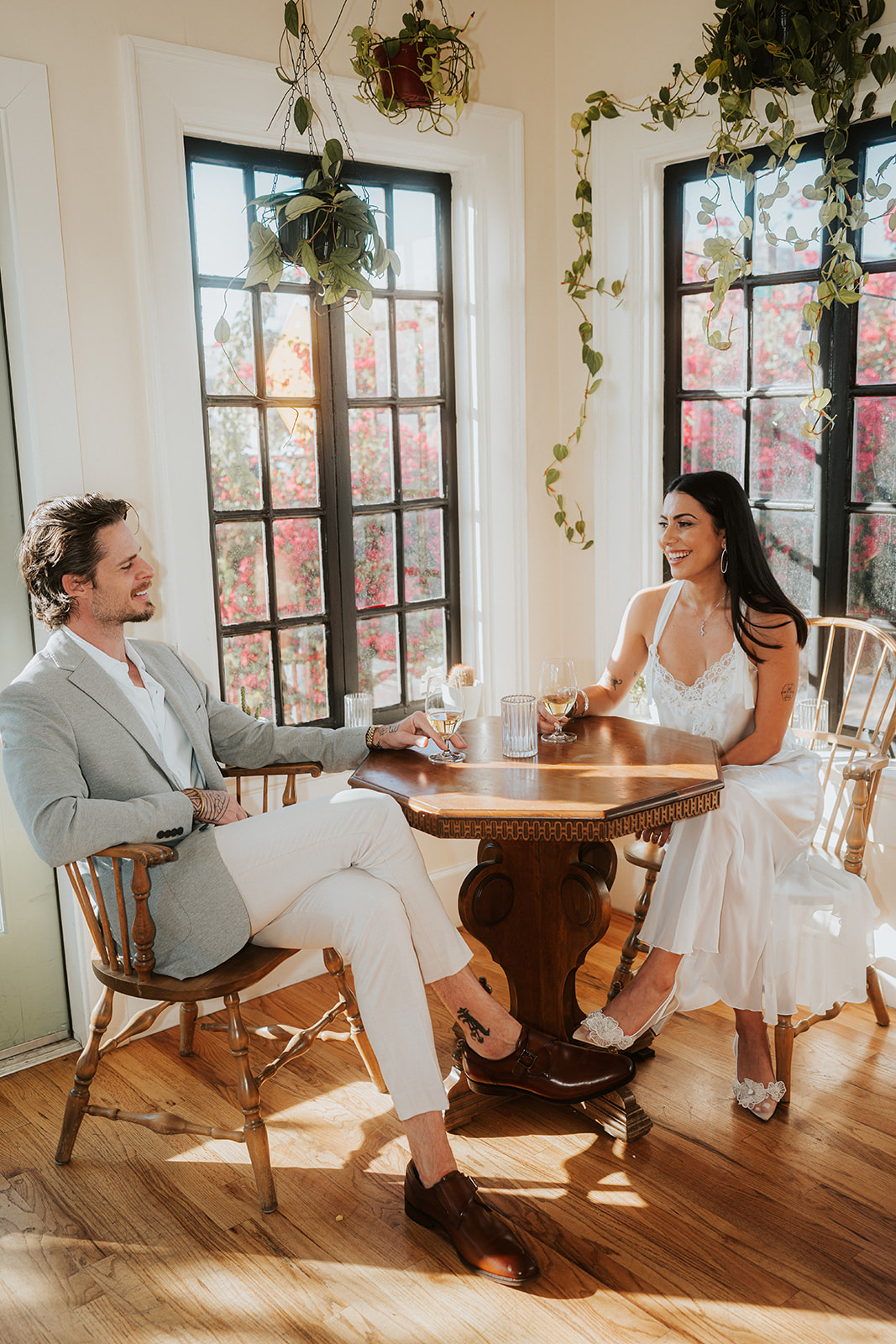 Phoenix courthouse wedding couple seated at table by window