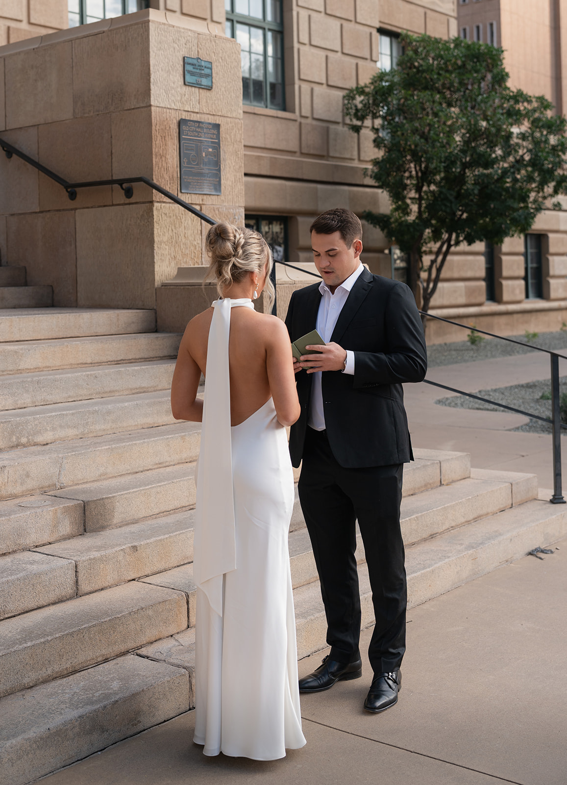 Phoenix courthouse wedding couple standing below courthouse entrance