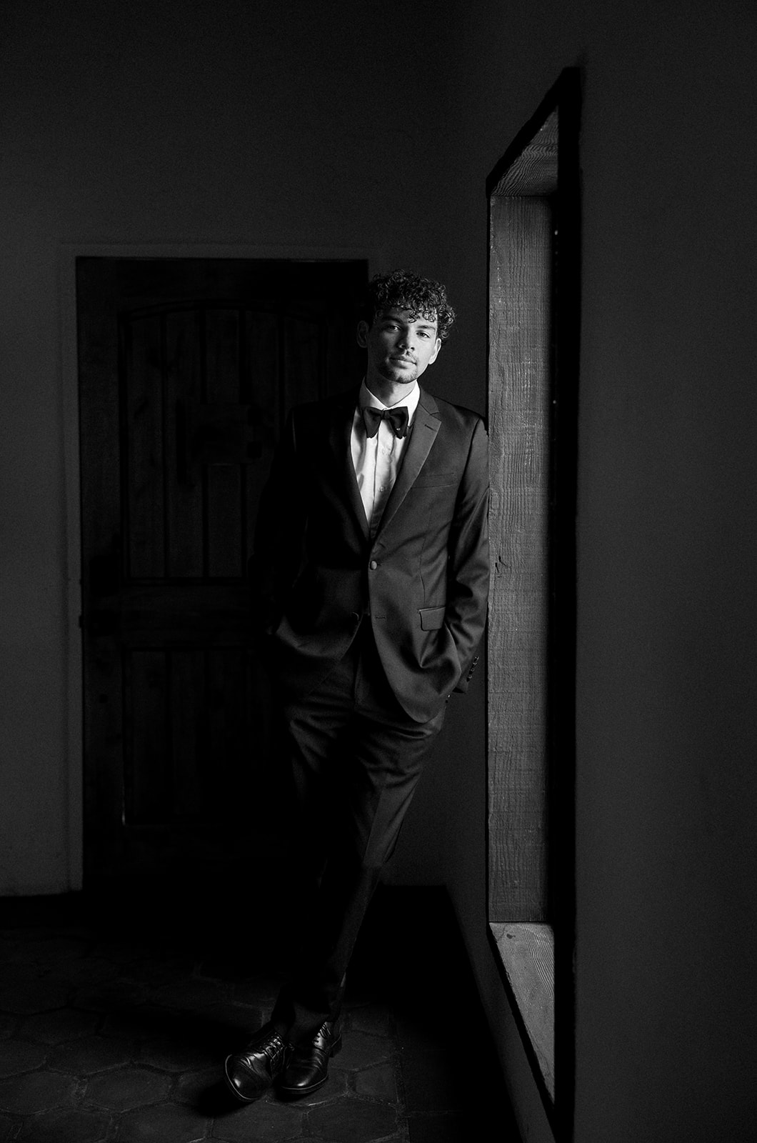 Joshua Tree House Tucson wedding groom portrait in doorway shadows