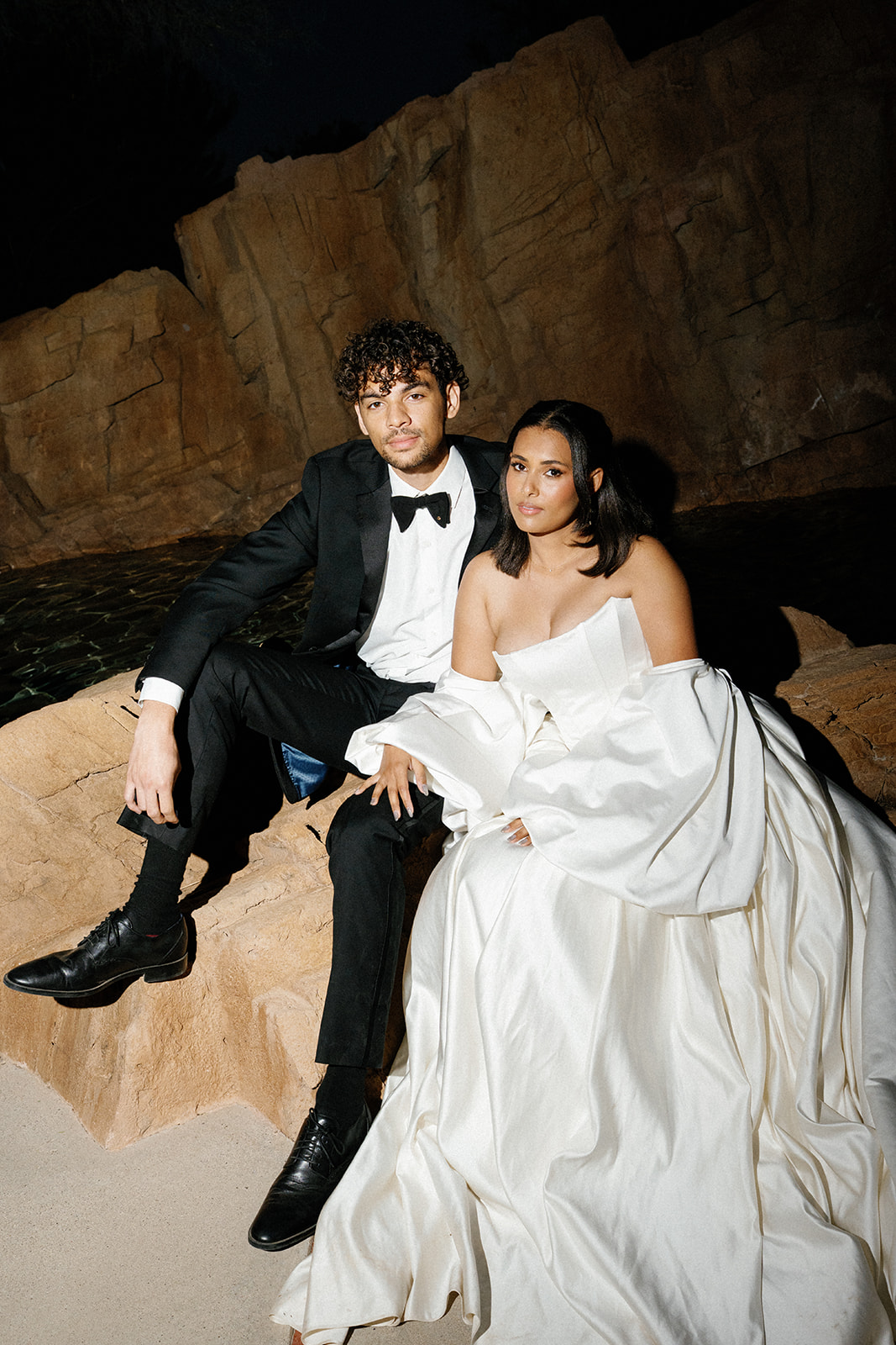 Bride and groom seated closely during Joshua Tree House Tucson wedding