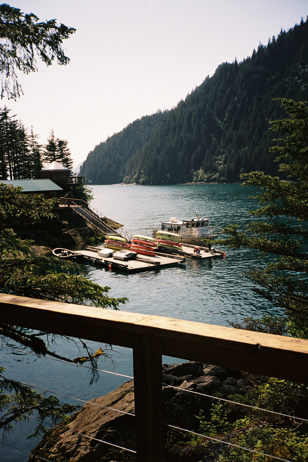 Scenic waterfront view from an intimate coastal elopement venue surrounded by evergreen mountains