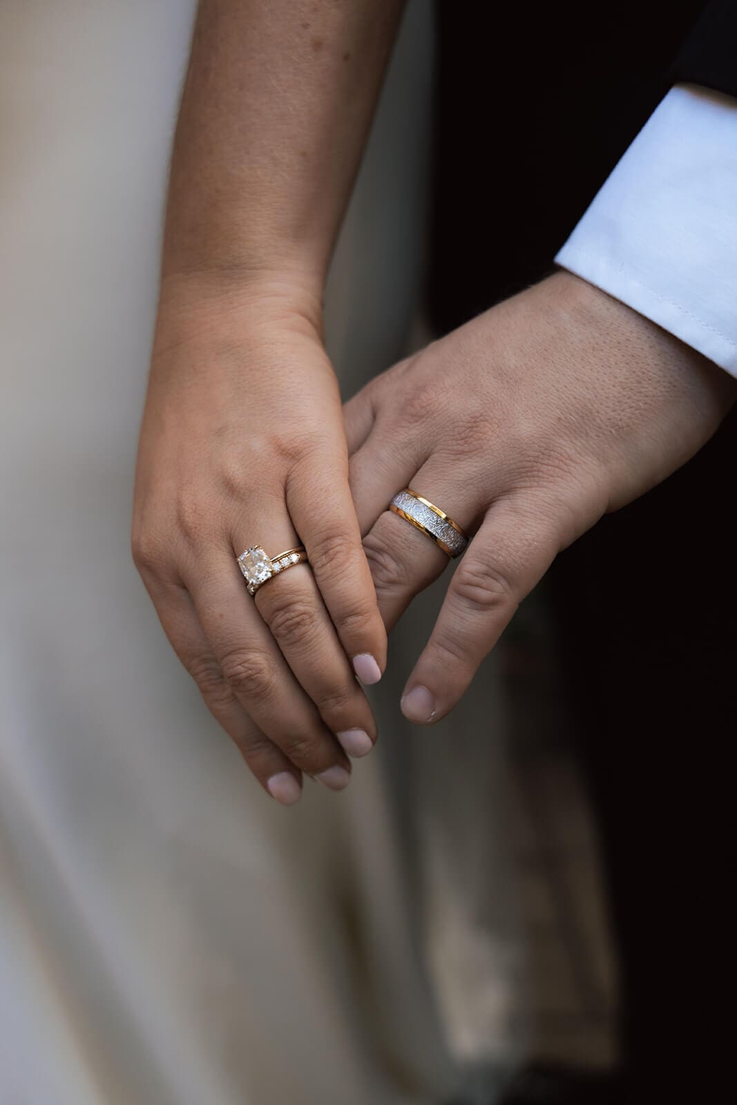 Close-up detail photo of the bride and groom’s hands showing wedding rings during a micro wedding at Tlaquepaque.