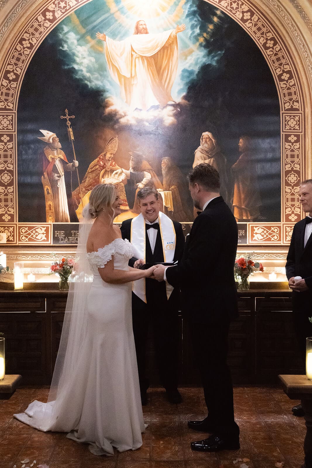 Bride and groom standing at the altar inside a chapel during their wedding ceremony at Tlaquepaque.