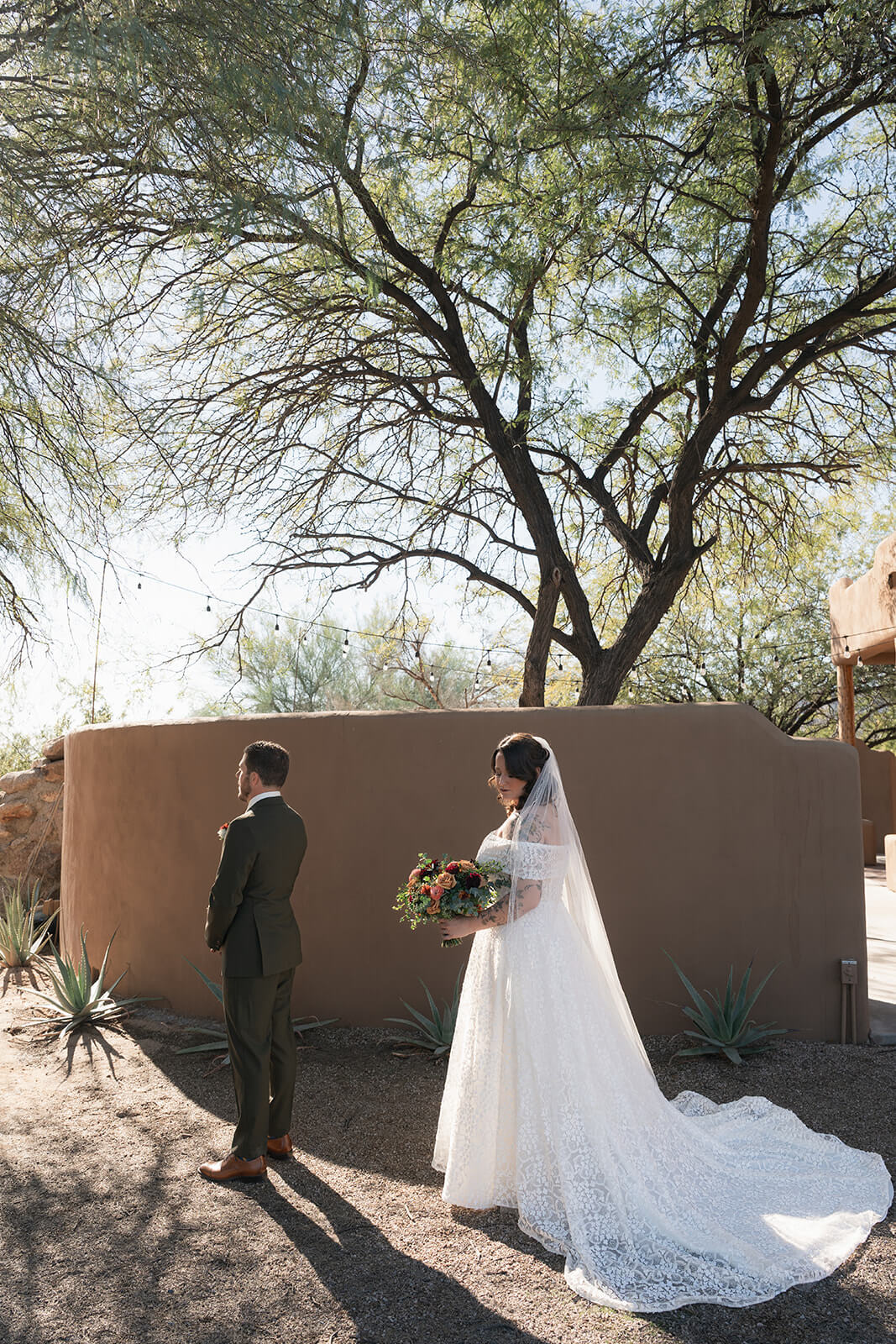 Bride approaching groom for a first look during a desert micro wedding in Arizona
