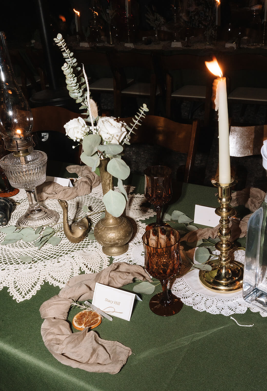 Romantic candlelit reception table details from an intimate outdoor micro wedding celebration