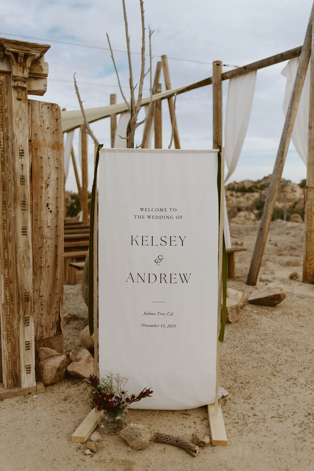 Custom wedding welcome sign with flowers and desert decor at Tierra del Sol.