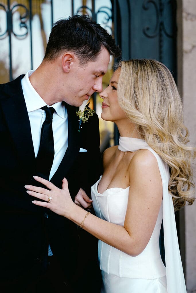 Bride and groom sharing an intimate portrait moment outside a villa during their Paradise Valley Airbnb wedding.