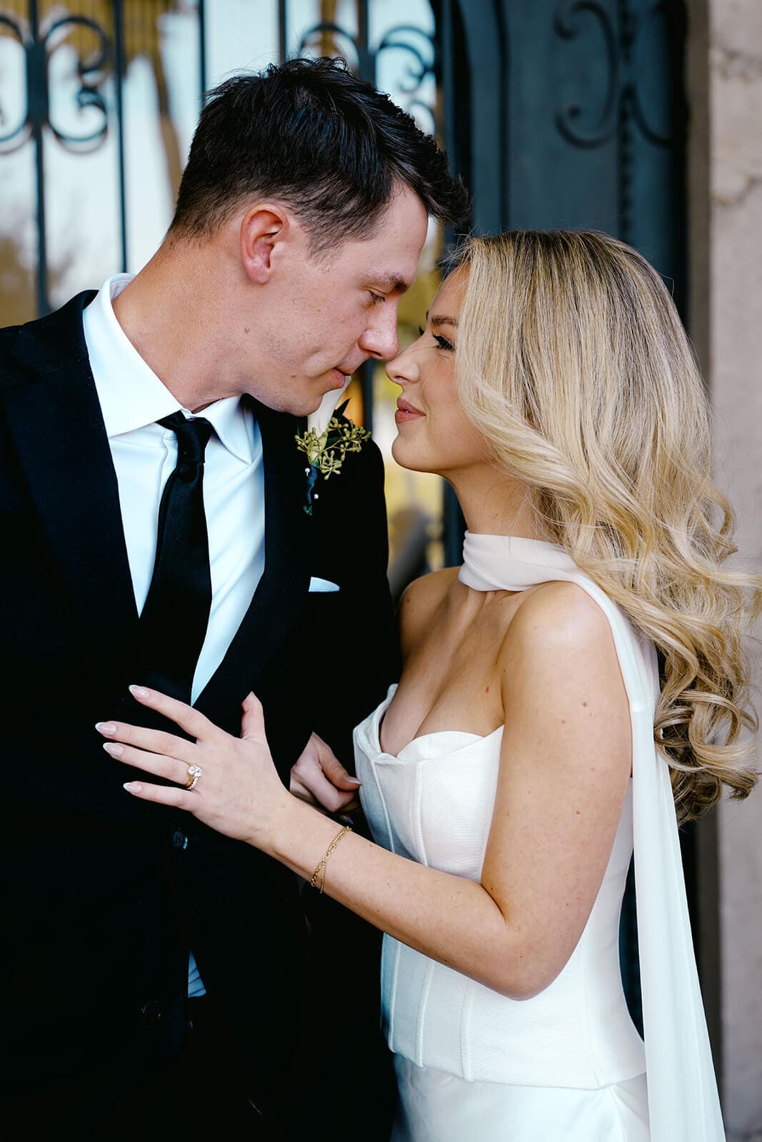 Bride and groom touching foreheads during an intimate wedding portrait.