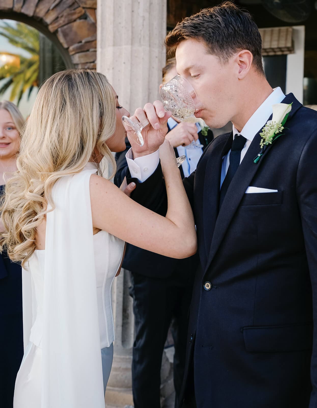 Bride and groom sharing a celebratory drink together after their intimate Paradise Valley Airbnb wedding.